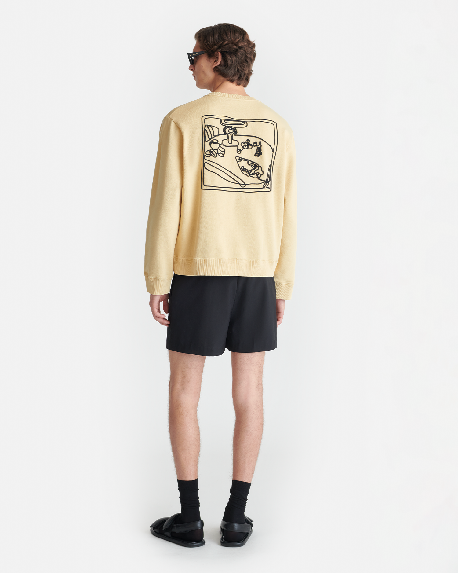 Sweat-shirt ras-du-cou molletonné en coton biologique brodé à motifs oversize crème et noir