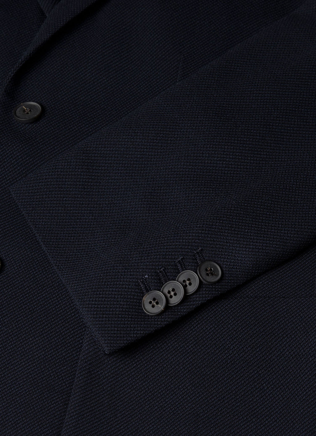 Blazer en laine marine déstructuré à revers cranté, coupe droite à deux boutons