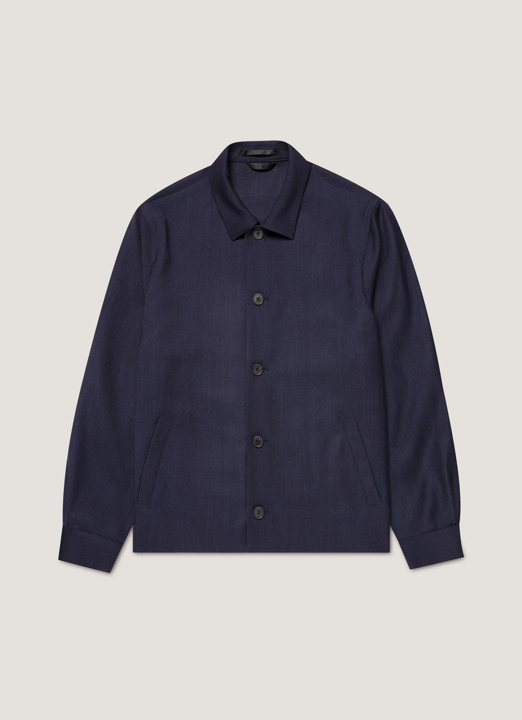 Veste boutonnée en sergé de laine bleu marine non structurée, demi-doublée, poches passepoilées