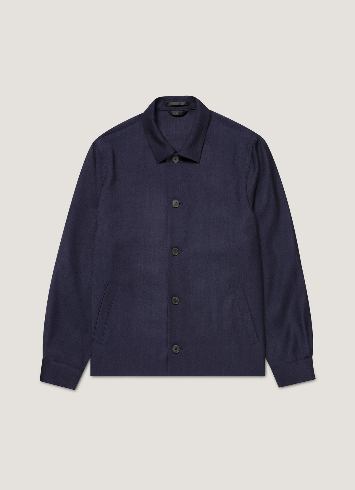 Veste boutonnée en sergé de laine bleu marine non structurée, demi-doublée, poches passepoilées